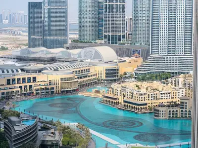 an aerial view of a city with buildings and water at Incredible View - Fountain show - 4BR - PS5 and Games in Dubai