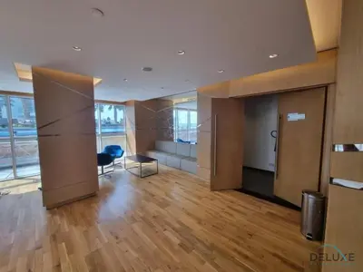 a room with a desk and a chair in a building at Inviting Studio in Damac Hills Carson B, Dubailand by Deluxe Holiday Homes in Dubai
