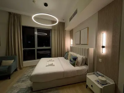 a bedroom with a large bed and a window at Vacay Lettings - Bay Central Tower - Studio in Dubai