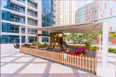 a playground with a canopy and a slide at Vacay Lettings - Bay Central Tower - Studio in Dubai