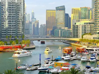 a group of boats docked in a harbor in a city at First Line Canal View Studio with Balcony MAX 4 Pax in Dubai