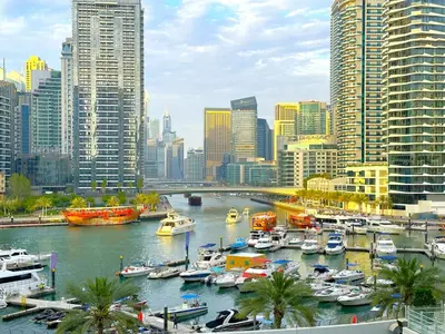 a group of boats docked in a harbor in a city at First Line Canal View Studio with Balcony MAX 4 Pax in Dubai
