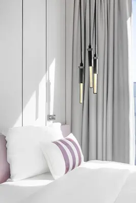 a bedroom with two white beds and a window at Vonder Bluewaters Residences SA2 in Dubai