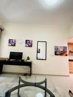 a living room with a piano and a mirror at Homes2Retreat - Studio in Lincoln Park Sheffield in Dubai