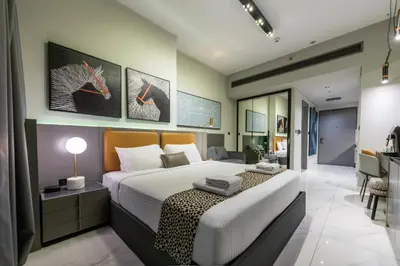 a bedroom with a large bed in a room at Canal View Studio Downtown - Near Dubai Mall & Burj Khalifa - MAG 318 in Dubai
