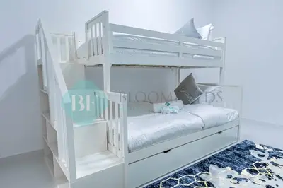 a white bunk bed in a white room at Bloomfields Modern 2br In Arabian Gate in Dubai