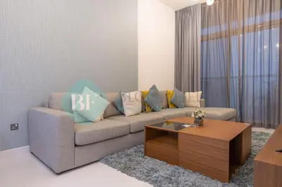 a living room with a couch and a coffee table at Bloomfields Modern 2br In Arabian Gate in Dubai
