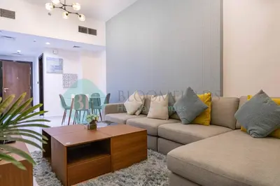a living room with two couches and a coffee table at Bloomfields Modern 2br In Arabian Gate in Dubai