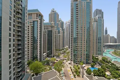 an aerial view of a city with tall buildings at Spacious 1 BR Apartment Near in Dubai