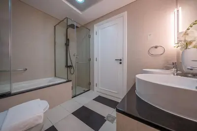 a bathroom with a sink and a toilet and a shower at Sky-High 1BR with Breathtaking Burj Khalifa View in Dubai
