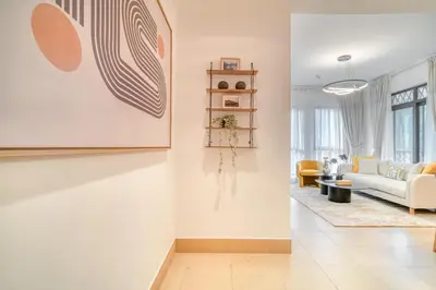 a living room with a couch and a table at Upscale 1-Bedroom Apt with Iconic Burj Khalifa View in Dubai
