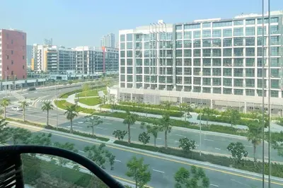 a view of a city street with a large building at Chic Studio with Balcony, Netflix and Chill Pet-free in Dubai
