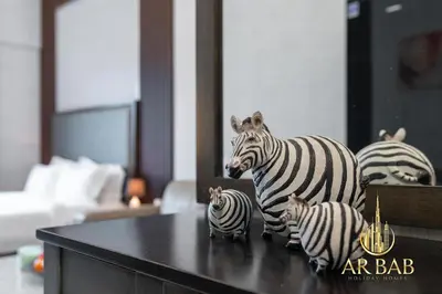 a group of zebras on top of a table at Elite Residence - Premium Studio - Best Horse Course View in Dubai