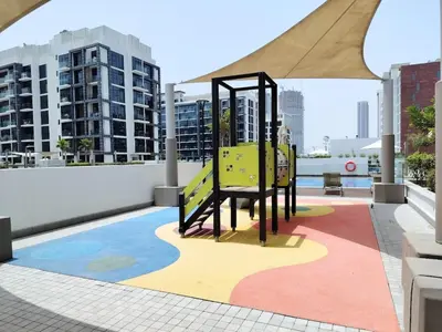 a playground on the roof of a building at Netflix and Wi-Fi Studio Pool, Gym & City Views in Dubai