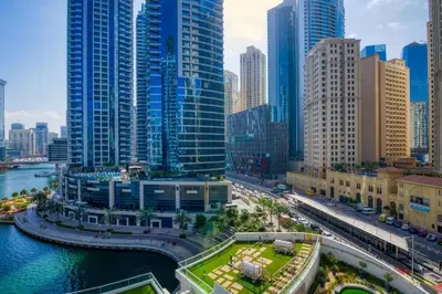 a city with a river and tall buildings at ShoresInn - Beautiful residence with Marina Views in Dubai