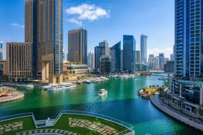 a river in a city with boats in the water at ShoresInn - Beautiful residence with Marina Views in Dubai