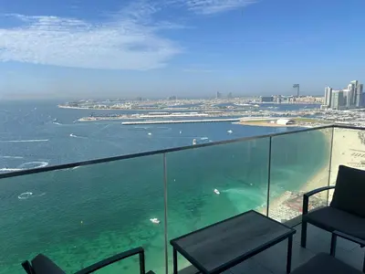 a view of the ocean from a balcony of a building at LA VIE JBR, Sea & Palm View Apartment in Dubai