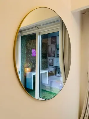 a mirror on a wall in a room with a window at Gorgeous 2BR with full Burj Khalifa view, 5 mins from Dubai Mall in Dubai