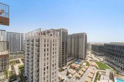 an aerial view of a city with tall buildings at WelHome - Beautiful 1BR Apt in Dubai Hills with City View in Dubai