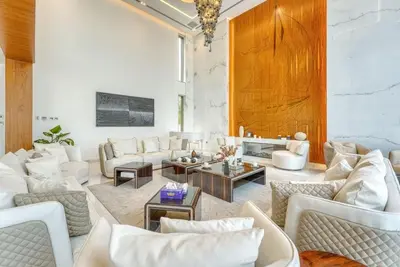a living room with white couches and a table at World Class Luxurious 6 BDR Villa In Palm Jumeriah in Dubai