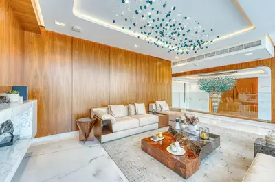 a living room with a couch and a table at World Class Luxurious 6 BDR Villa In Palm Jumeriah in Dubai
