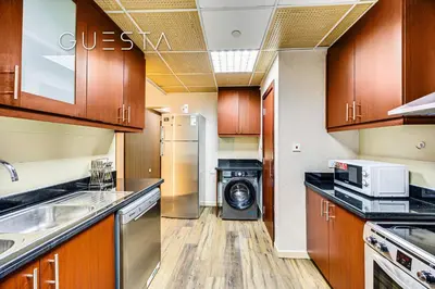 a kitchen with a washer and dryer in it at Jumeirah Beach Residence - Bahar 1, Dubai Marina in Dubai