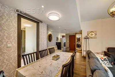 a living room with a table and a couch at Jumeirah Beach Residence - Bahar 1, Dubai Marina in Dubai