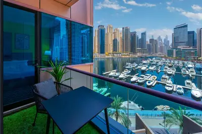a balcony with a view of a harbor with boats at Full Sea View in Dubai Marina - Balcony & Pool in Dubai