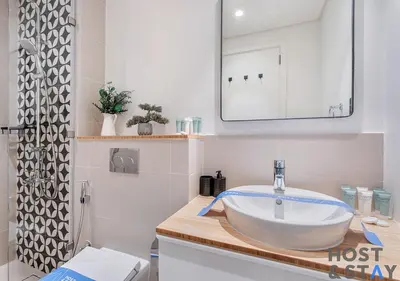 a bathroom with a sink and a mirror at Elegant 2-BR Retreat In Dubai Hills in Dubai