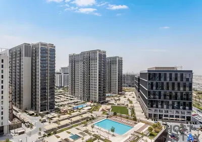 an aerial view of a city with tall buildings at Minimalist 2BR in Dubai Hills in Dubai