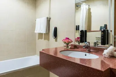 a bathroom with a sink and a bath tub at Jannah Place Dubai Marina in Dubai