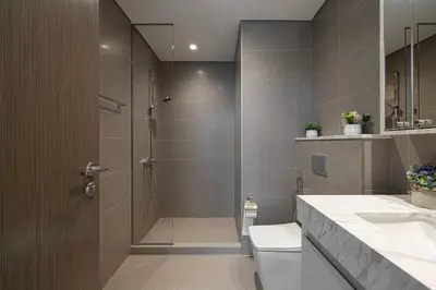 a bathroom with a shower and a toilet and a sink at 2 BR Dubai Luxury apartment Full Burj Views in Dubai