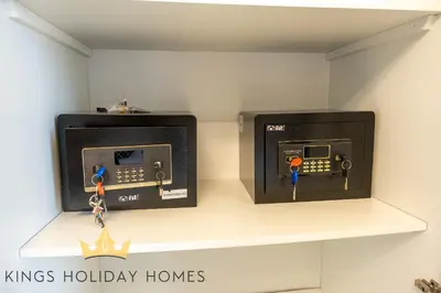 two electrical boxes on a shelf in a room at Dunya tower 2 downtown burj khalifa street Kings in Dubai
