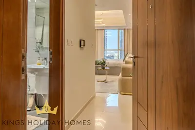 a hallway with a bathroom with a sink and a mirror at Dunya tower 2 downtown burj khalifa street Kings in Dubai