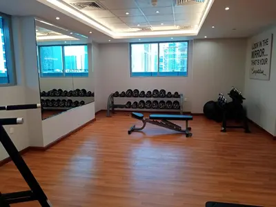 a room with a gym with exercise equipment in it at Elite Residence - Business Bay in Dubai