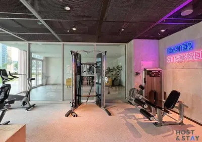 a gym with two treadmills and a gym at Stunning 1bed In Dubai Hills in Dubai