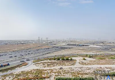 an aerial view of a highway with cars on it at Stunning 1bed In Dubai Hills in Dubai