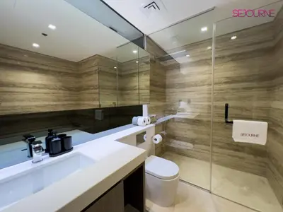 a bathroom with a sink and a toilet and a shower at #140 Elegant 1BR with Burj Khalifa View in Business Bay in Dubai