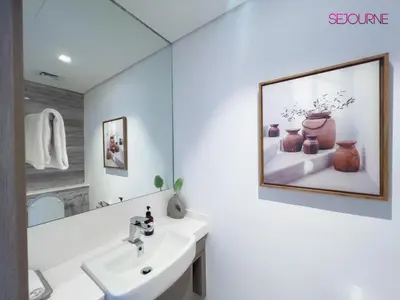 a bathroom with a sink and a mirror at #140 Elegant 1BR with Burj Khalifa View in Business Bay in Dubai
