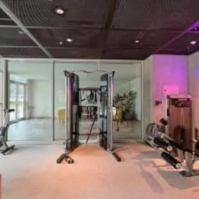a room with a gym with two treadmills at Elegant 1BR In Collective, Dubai Hills in Dubai