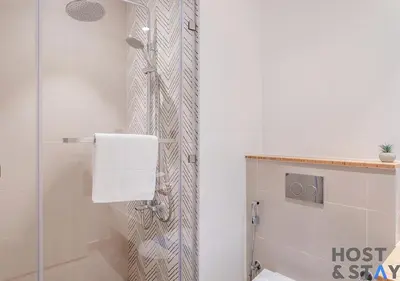 a bathroom with a shower stall and a toilet at Amazing 1BR in Collective2, Dubai Hills in Dubai