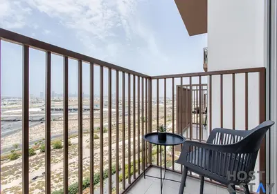 a balcony with a bench and a view of the beach at Stylish 1BR Apt In Collective 2 in Dubai