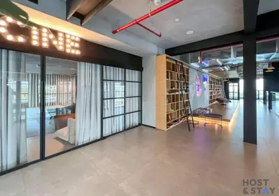 a large room with glass doors and a lobby at Stylish 1BR Apt In Collective 2 in Dubai