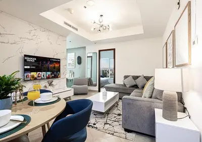 a living room with a couch and a table at Luxury home with stunning view in Dubai