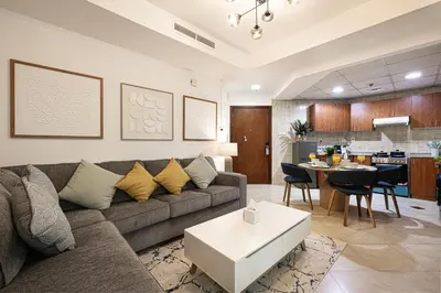 a living room with a couch and a table at Luxury home with stunning view in Dubai