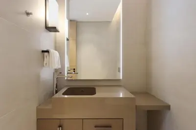 a bathroom with a sink and a mirror at 1BHK with Marina and Partial Sea Views in Dubai