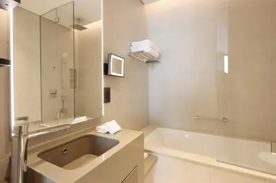 a bathroom with a sink and a bath tub at 1BHK with Marina and Partial Sea Views in Dubai