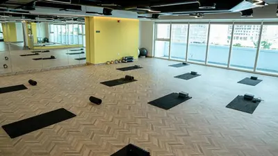 a large room with a lot of yoga mats at Medore Brand New Flat in Dubai - 8 in Dubai