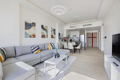 a living room with a couch and a table at Medore High Floor Brand New Apartment - 27 in Dubai