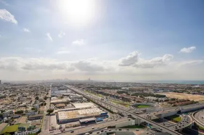 an overhead view of a city with a highway at Aykon City 2 bedroom Burj view in Dubai